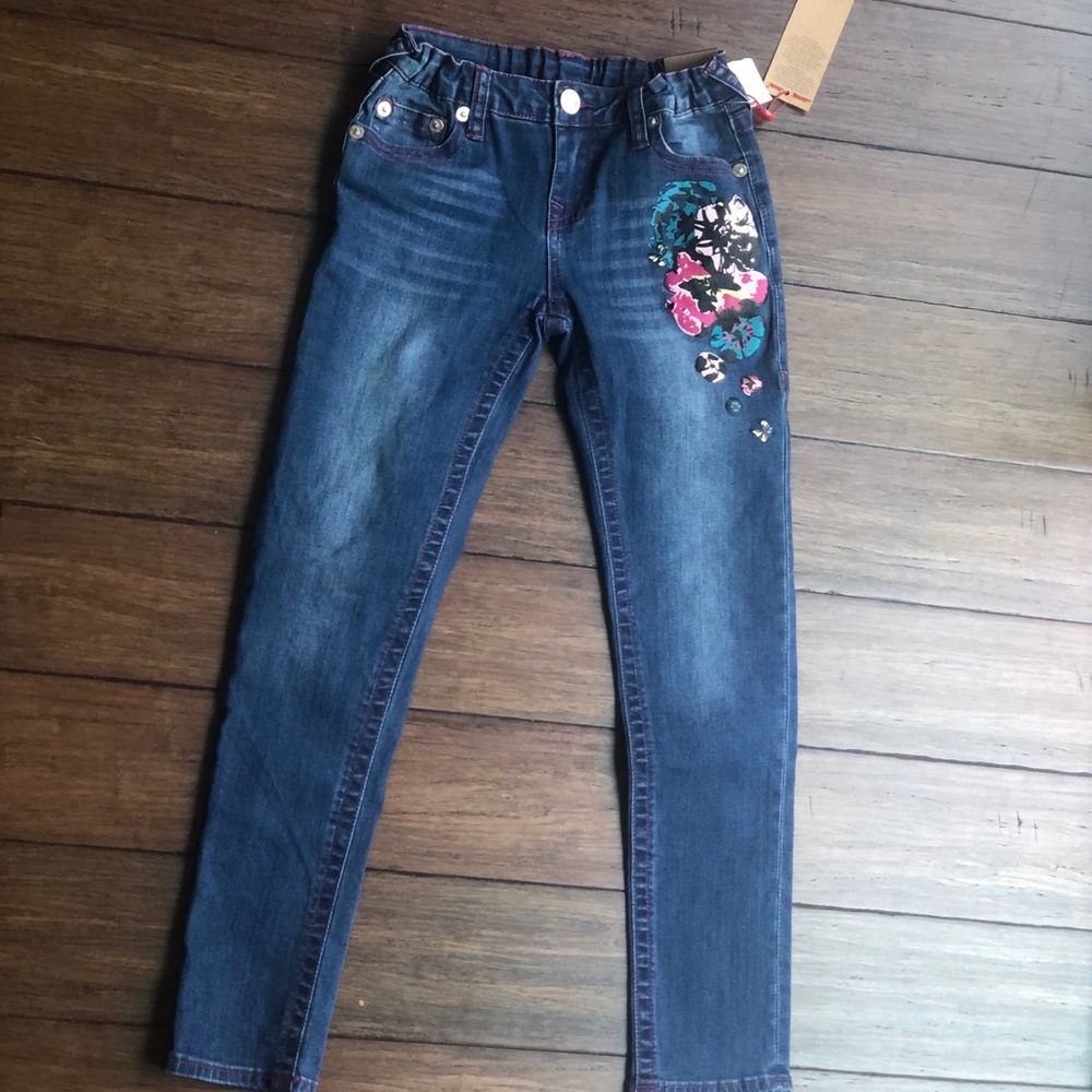 True region medium wash skinny jeans with flowers